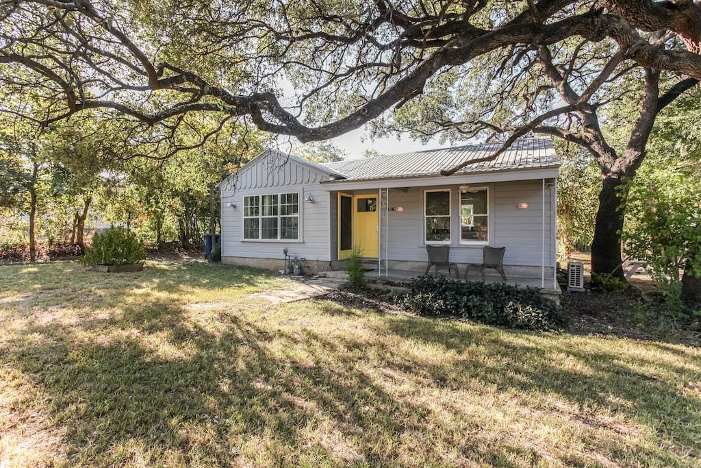 House is shaded by a majestic Live Oak