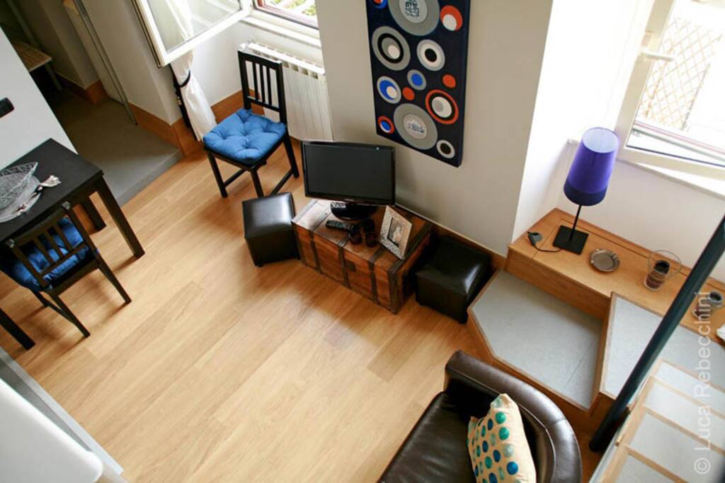 View of the living room from the loft area (where the bed is)