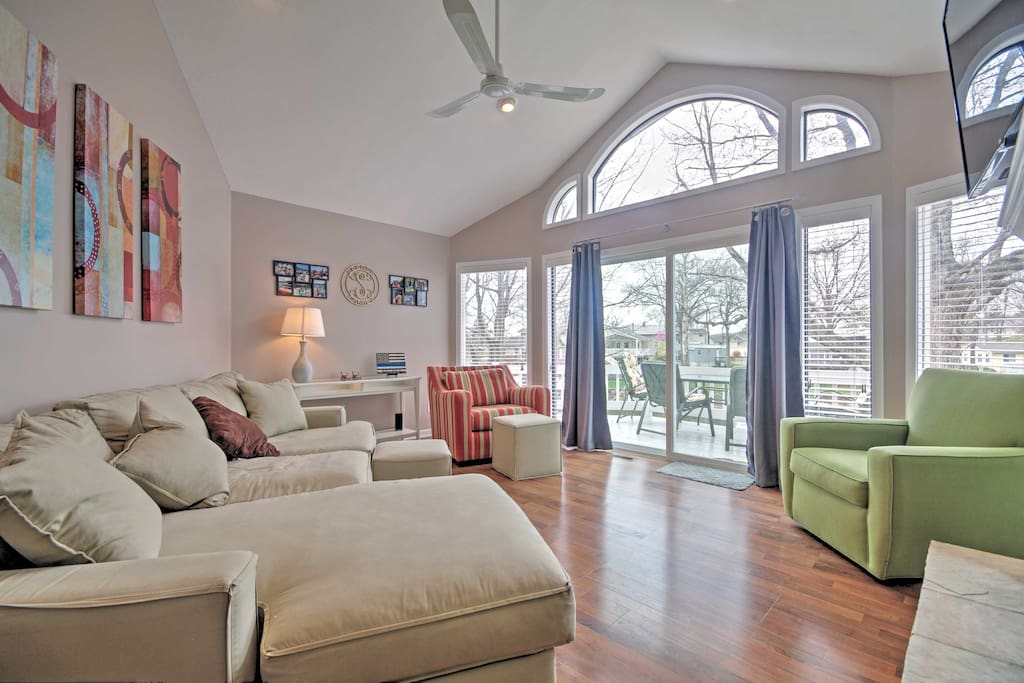 Floor to ceiling window treatments allow natural light to flood throughout this home.