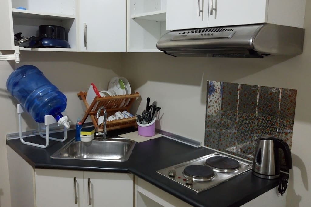 A kitchen complete with your cooking needs.