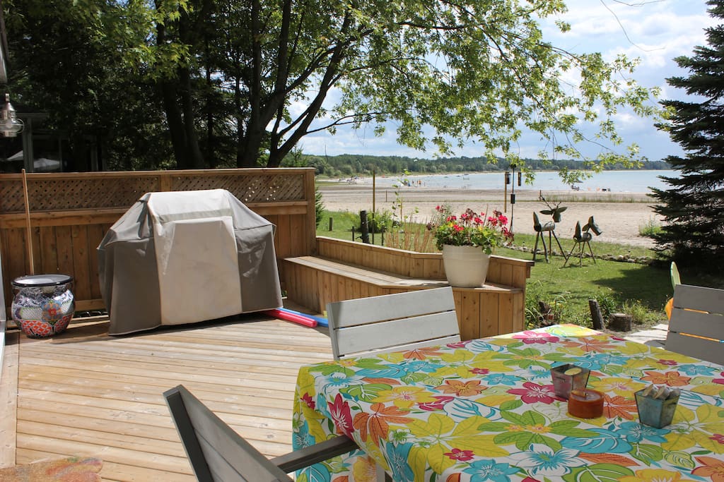 beach side deck with eating area and BBQ