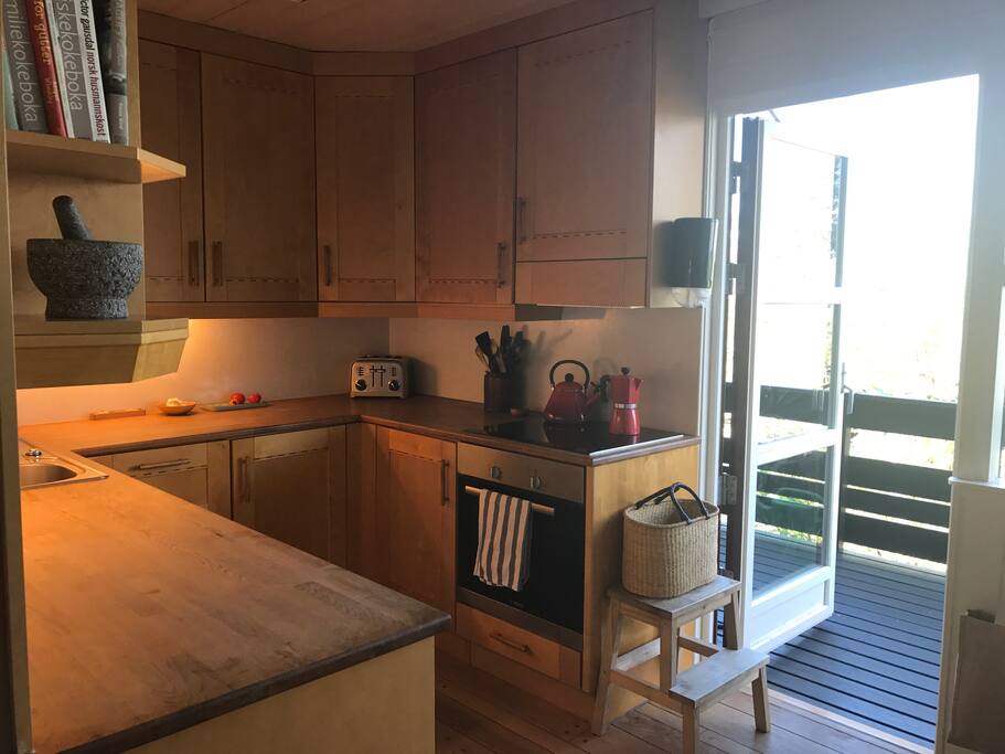 Kitchen, leading out to the balcony with view on the fjord