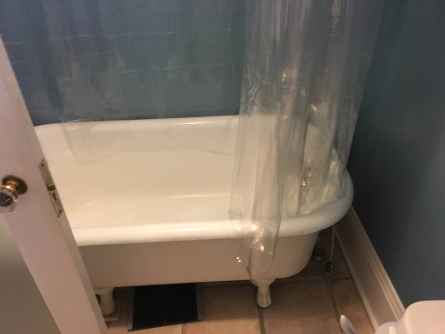 Private bathroom worth clawfoot tub and shower head.