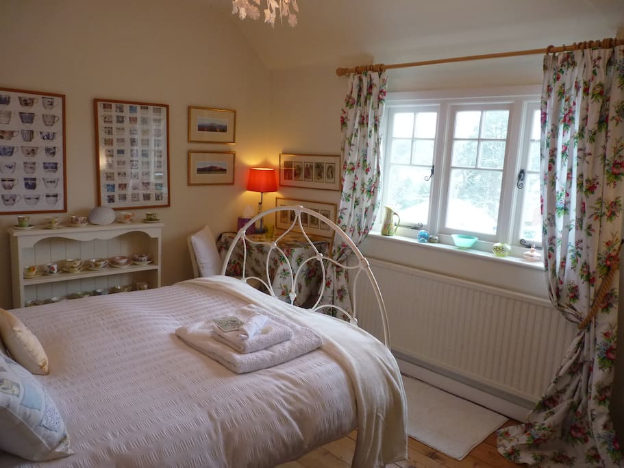 the guest bedroom with elevated views over the village.