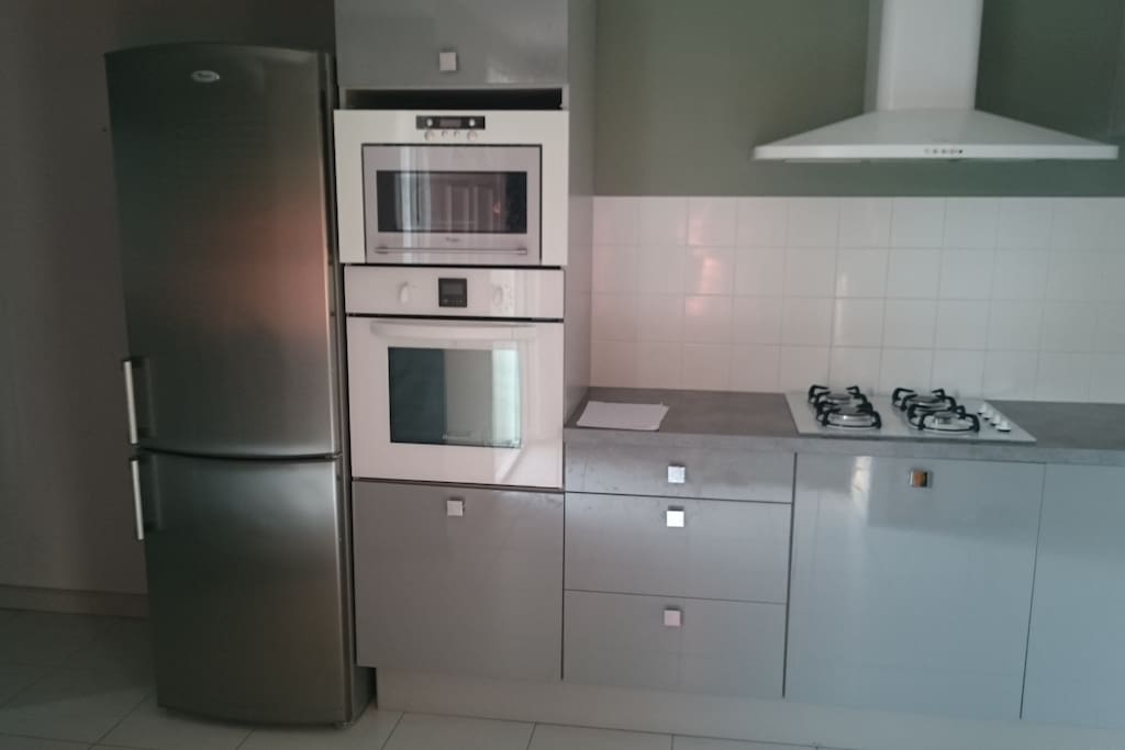 Kitchen with oven and microwave