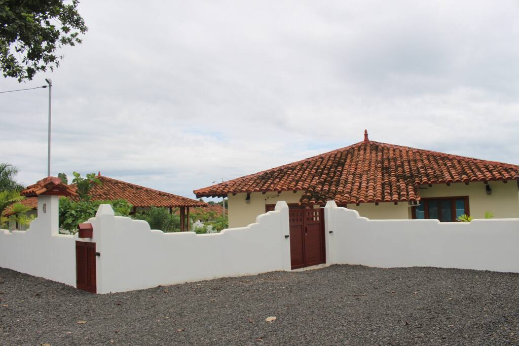 Oversized parking for two cars with gated fence around the property