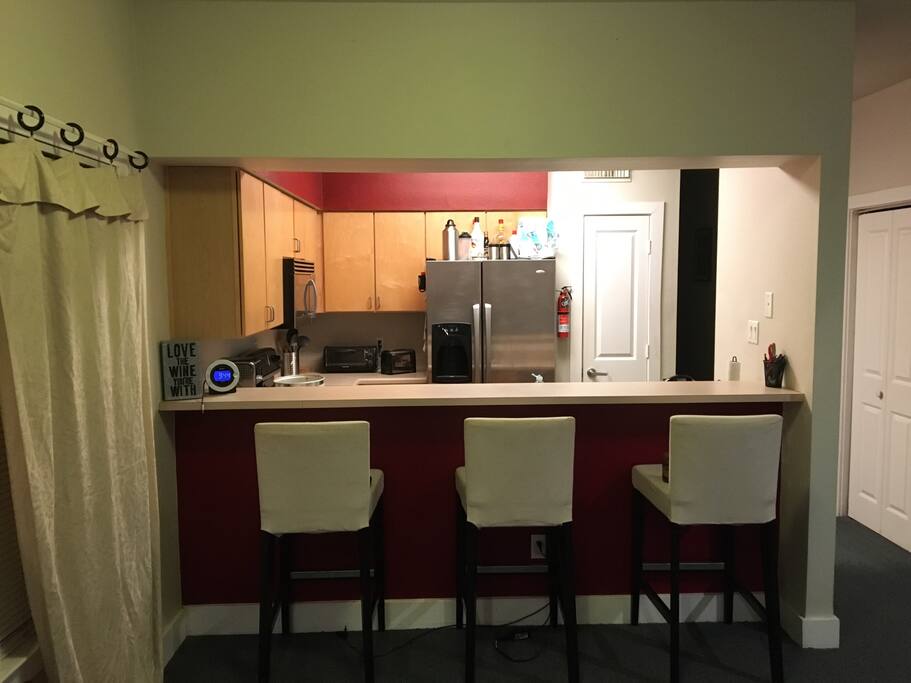 Looking into the kitchen/bar area from living room