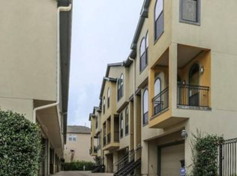 The two car garage is accessible from this gated driveway located behind the house.