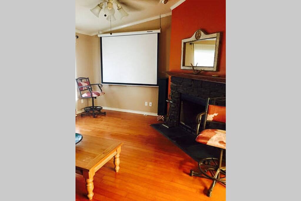 Living area with fireplace and big screen w over 100 movies to choose from