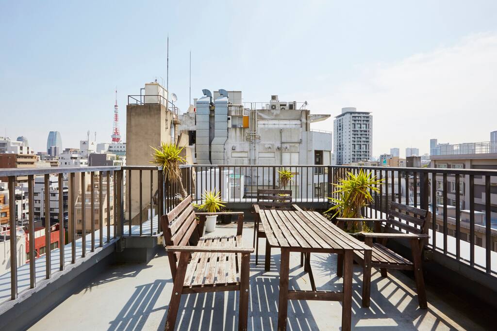 Massive rooftop balcony overlooking the city in all directions, including a view of Tokyo Tower.