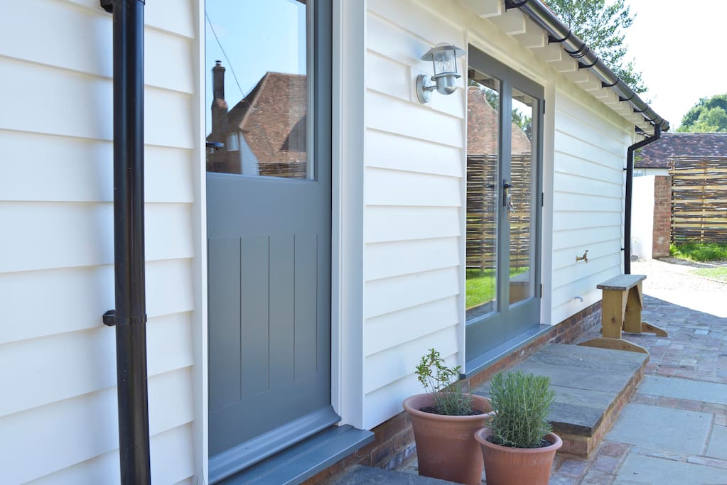 Outside is a private space with patio and table and chairs. And a BBQ!