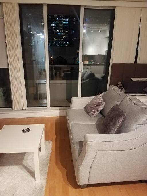 View of living space and balcony