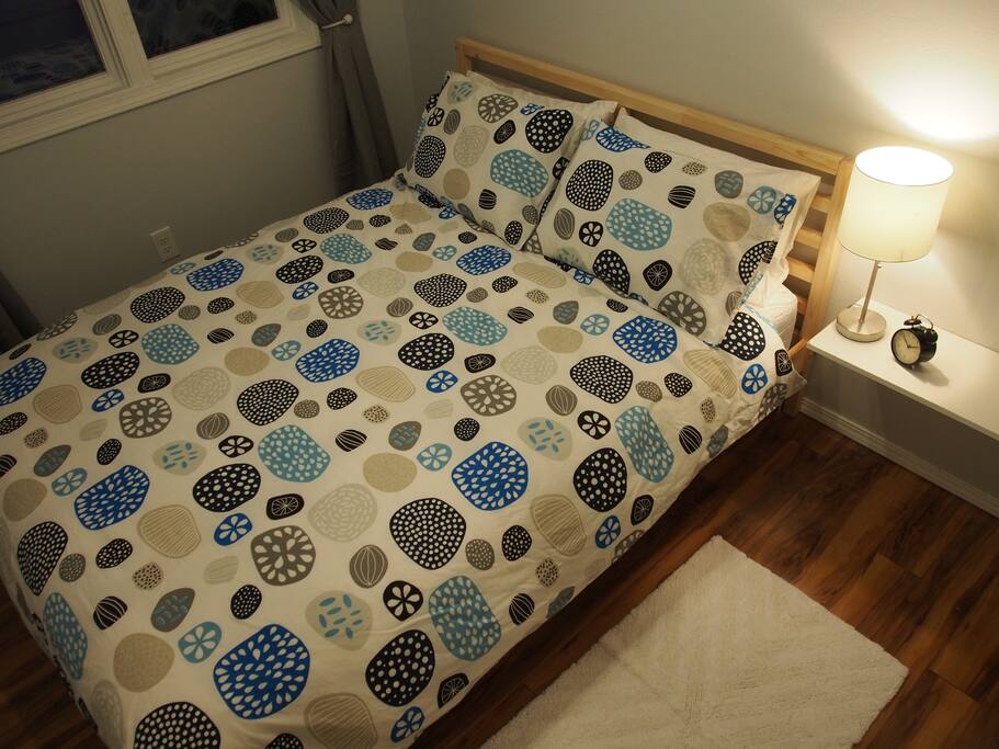 The smaller bedroom still has a lovely Queen sized bed. With a closet stocked with shelving and wooden hangers for your clothing, it has plenty of room for everything you need!
