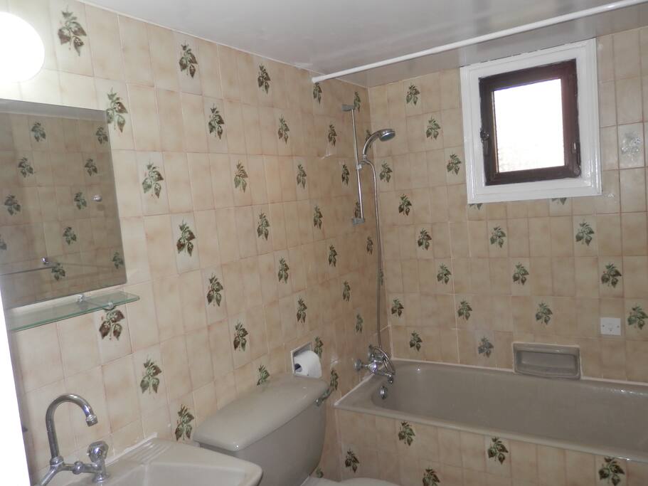 Bathroom: The bathroom includes a full size bathtub!