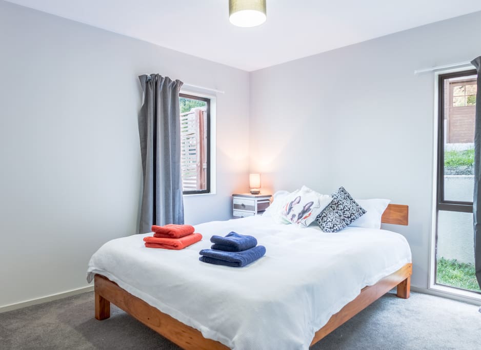 Bedroom with queen bed and built in wardrobe
