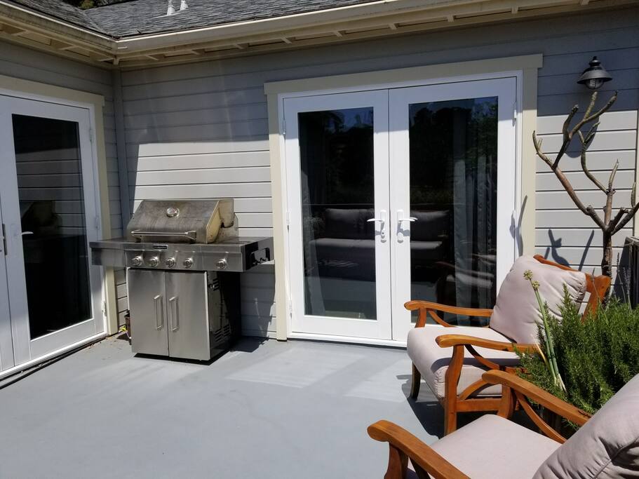 The outdoor living area has a gas bbq, furniture and great views.
