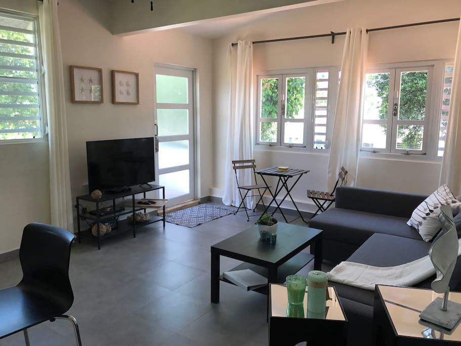 Bright and clean living area with Smart TV