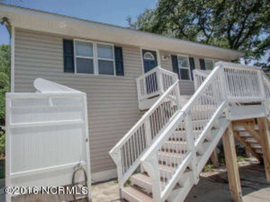 front door, outdoor shower below