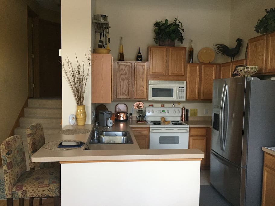 Kitchen is efficient and clean. All appliances work well and a Kurig is included. The refrigerator is open to you and is loaded with bottled water. From the kitchen you will be able to interact with your fellow travelers that are enjoying the living room.