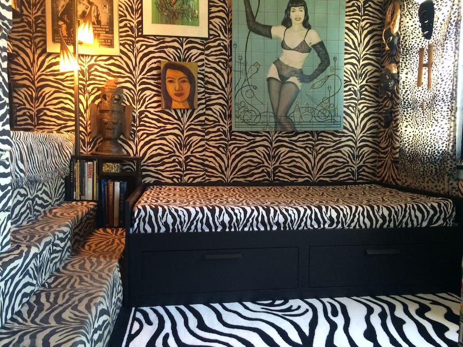 The most current photo of the zebra guest room with a bed that folds out into twice its size.