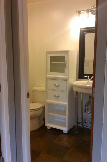 Full bathroom with bath tub. Towles provided