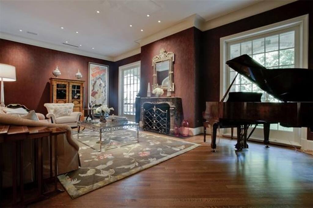 Formal Living space with gas logs in fireplace.