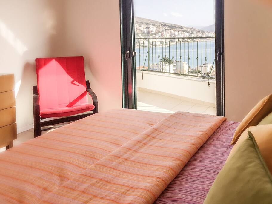 Master bedroom with a king size bed. Gorgeous view of Sarande seashore from your bed!