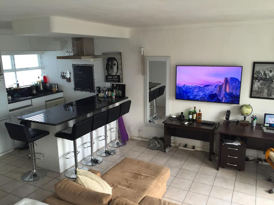 kitchen bar and large tv, viewable from bed