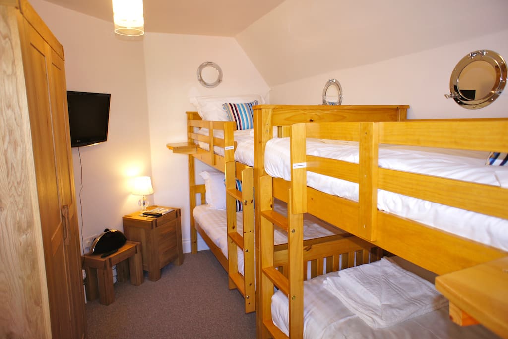 Bedroom three is a children's room with two sets of bunk beds