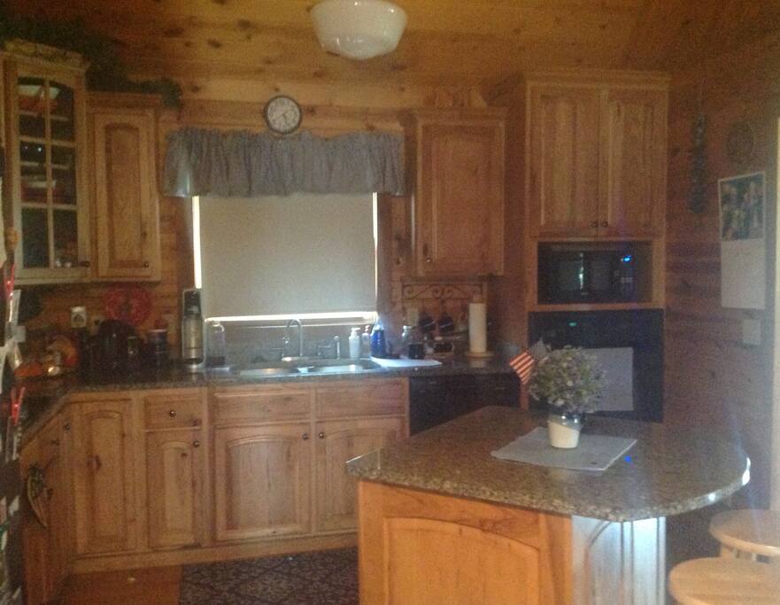 Kitchen. Dishwasher fridge microwave oven stovetop