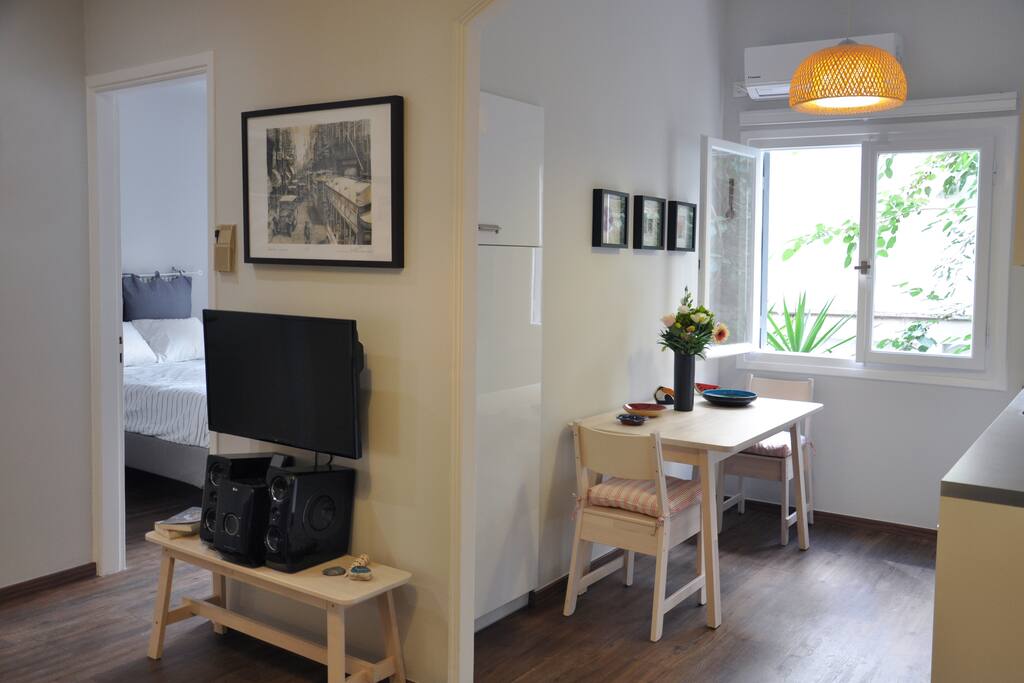 Panoramic overview of the apartment, showing the three main spaces