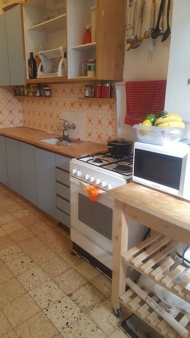 Accessorized kitchen, washing machine.