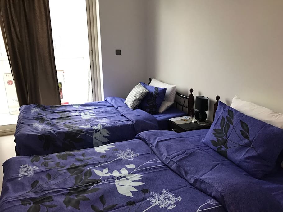 Twin beds in the master bedroom