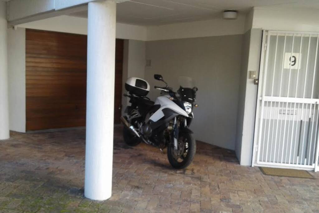 Covered guest parking outside apartment in secure complex