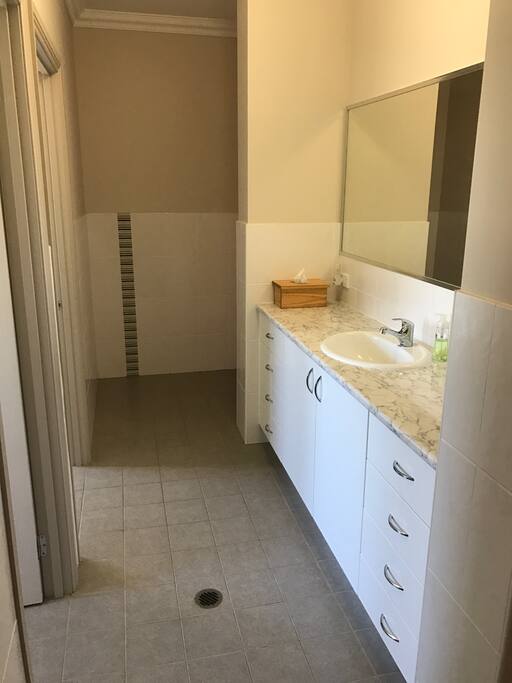 Large walk through vanity area, separate shower room and 2 separate toilets