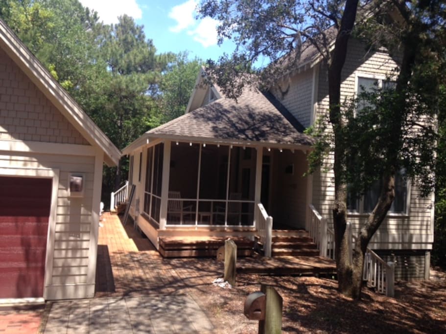 House with cart garage which holds golf cart, beach chairs, beach toys, bicycles, skim and boogie boards and more!