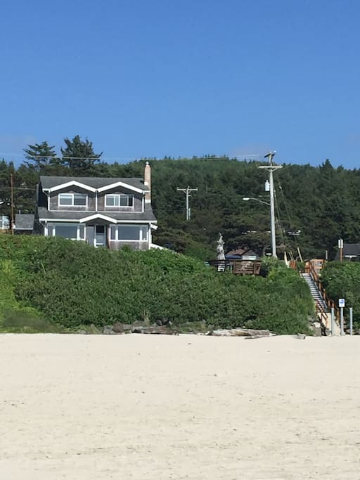 View of house from the beach. Stairs to beach located on the South side of property