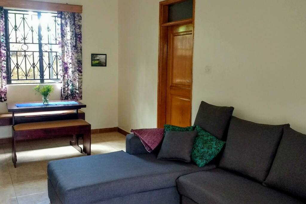 Cozy sitting room and dining table. Lots of natural light!
