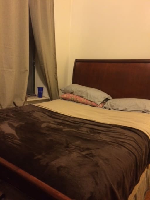 Queen sized sleigh bed with ottoman.