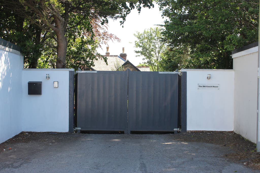 Main entrance with secure electric gates.