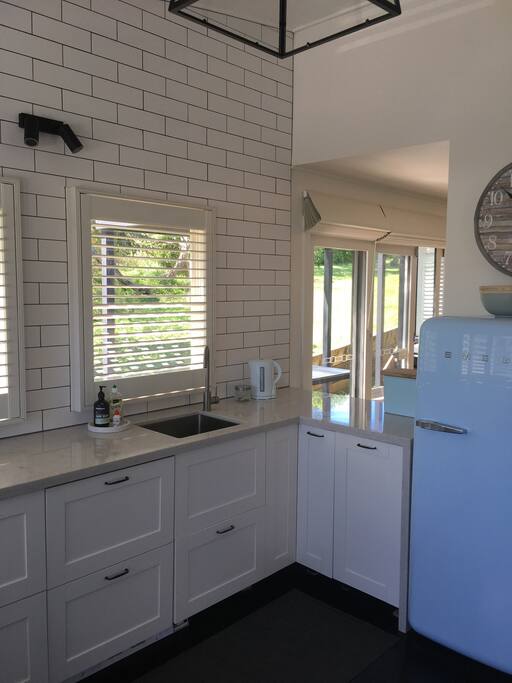 Kitchen - Stone bench tops, dishwasher, Nespresso machine.