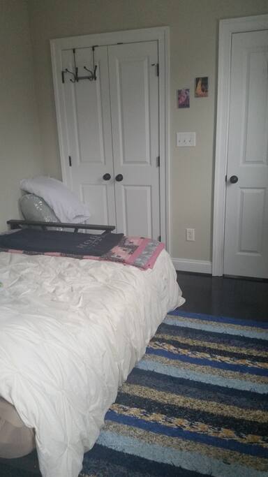 Small closet with some space to hang clothes.