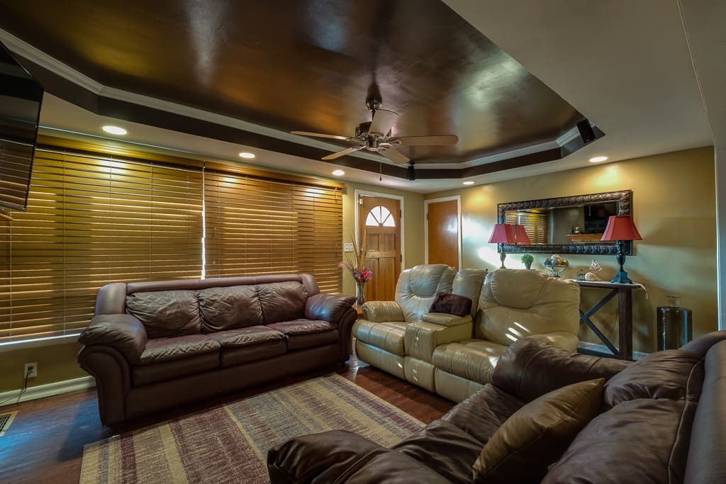 Lots of seating on plush leather furniture.
