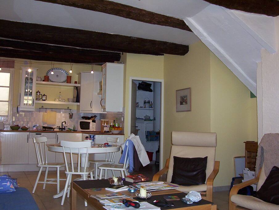 As you enter the front door our bright & modern kitchen & lounge room with toilet through the door on the left