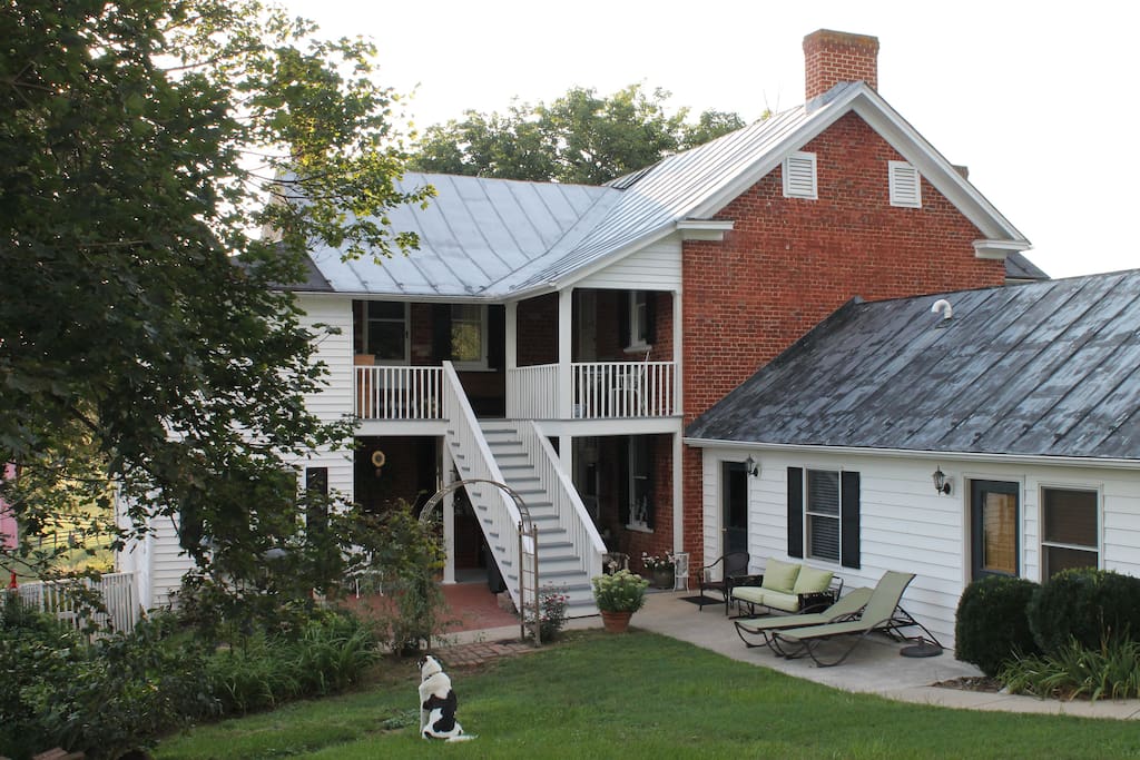 East-facing upstairs porch, accessible from both bedrooms, downstairs patio