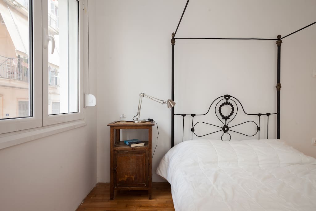 Double bed with side table.