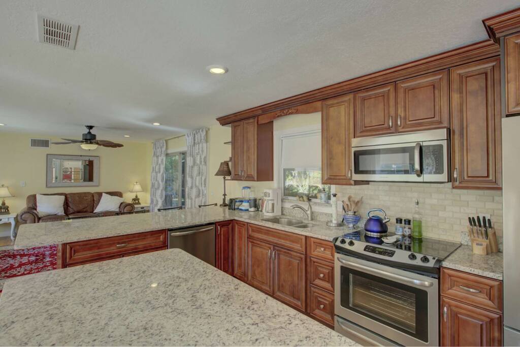 Beautifully updated, fully stocked stainless kitchen with granite island and plenty of counterspace to cook your favorite dish.