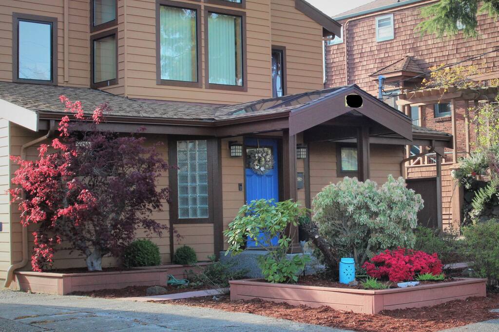 Exterior of the house. The private entrance to the apartment is to the right.