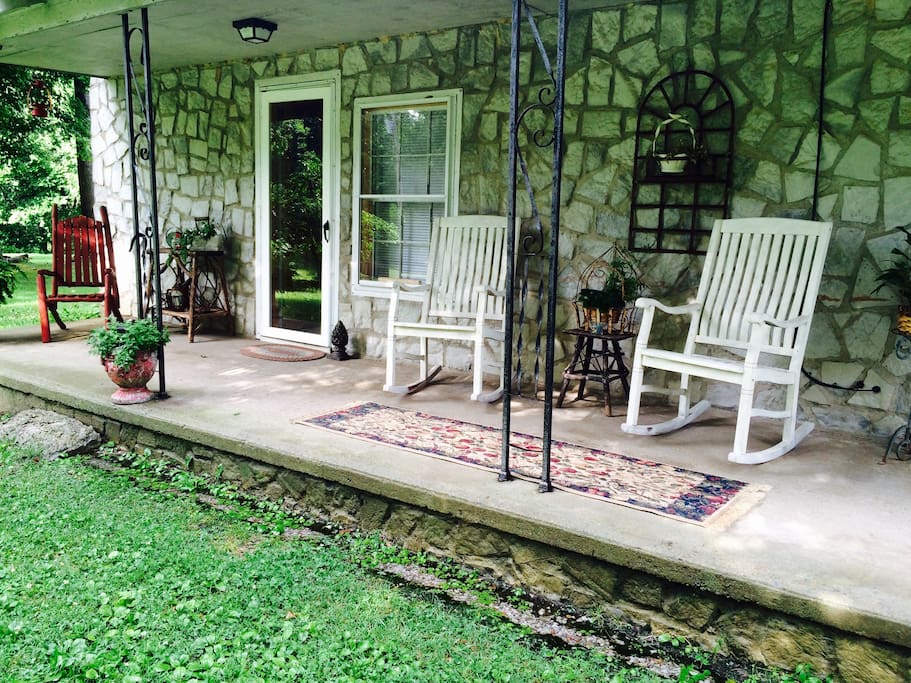 Relax on the front porch with a quite country view.