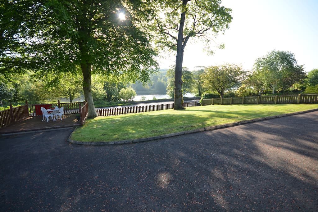 View of front lawn leading onto Castleroe road with walk/cycle path and river Bann beyond.